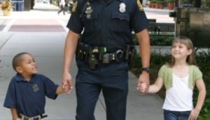 police officer walking children