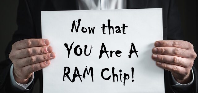 man holding sign saying you are now a ram chip